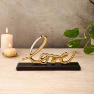 aapka yeh naya product aapki metal on wood emotional typography series ka sabse romantic, cozy aur globally appealing product hai—dci "love" cursive word art on wood base (gold edition). yeh variant valentine's day, luxury weddings, couples' anniversaries, aur bedroom nightstand decors ke liye aapka absolute hero bestseller banega. isme premium polished gold aluminium cursive script ko ek chunky solid black wood base par mount kiya gaya hai. iska weight vahi high end 815 grams hai, par iska structural dimension thoda micro aur compact (19 cm length) rakha gaya hai taaki yeh bedside tables, dressing areas, aur cosy bookshelf corners mein perfect space saver statement ban sake. aapki website (dcidecor.com) ke liye iska complete, perfectly formatted copy paste ready data ye raha: 1. product titles & pricing product name (short title): dci "love" gold metal word art on black wooden base full seo title: dci love word art tabletop sign – premium gold aluminium cursive sculpture on solid black wood base